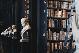 Classical library with busts and books, symbolizing scholarship and learning
